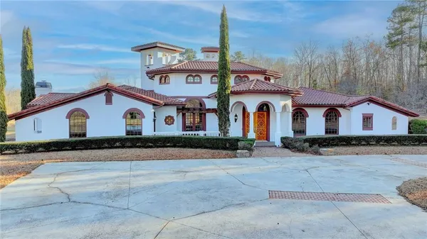 a front view of a house with yard
