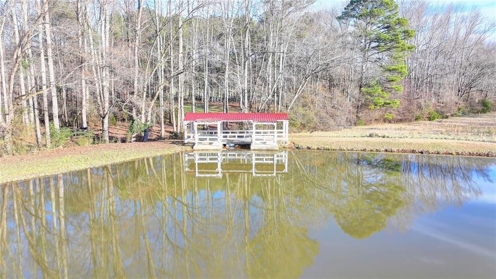 1540 Lipscomb Road Social Circle, GA 30025 - Photo 115 of 130 a swimming pool with outdoor seating and yard