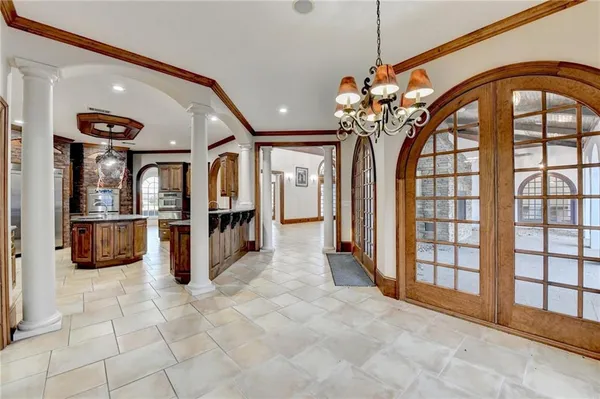 a spacious bathroom with a tub shower and mirror