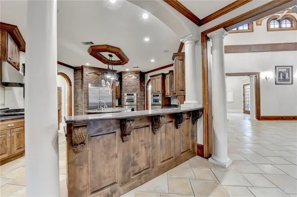 a bathroom with a granite countertop sink two mirror and a