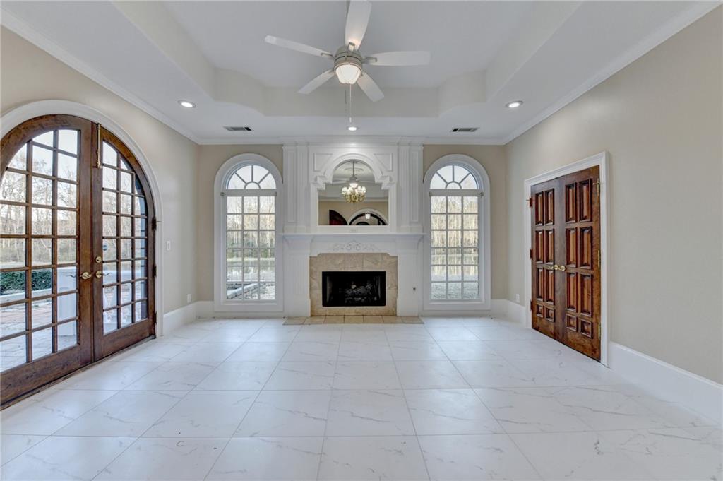 1540 Lipscomb Road Social Circle, GA 30025 - Photo 40 of 130 a view of an empty room with a fireplace and a window