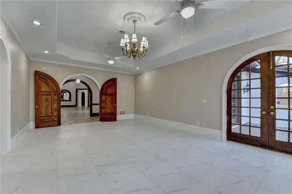 a view of a patio with a table and chairs under an umbrella