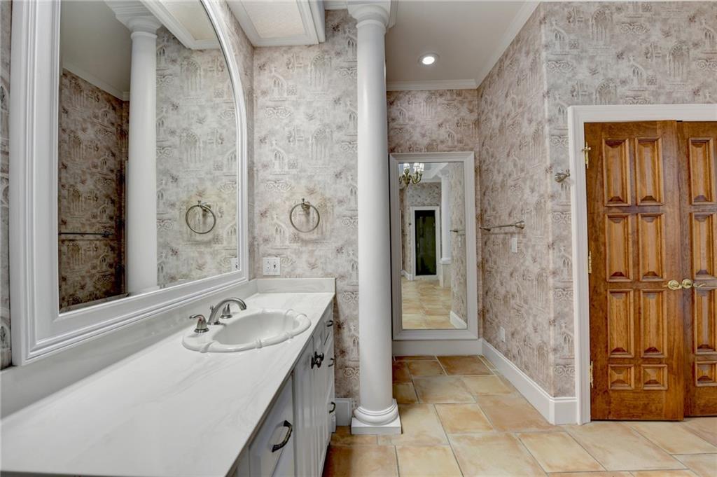 1540 Lipscomb Road Social Circle, GA 30025 - Photo 44 of 130 a bathroom with a sink a mirror and a shower