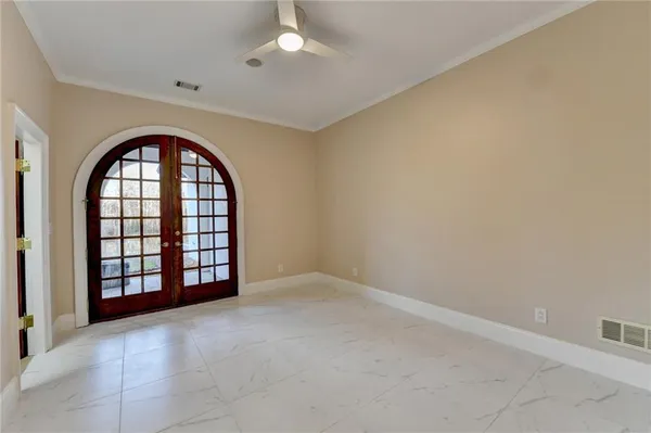 a view of a wooden floor and a yard in back