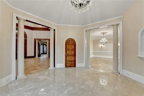 a view of a room with furniture and window