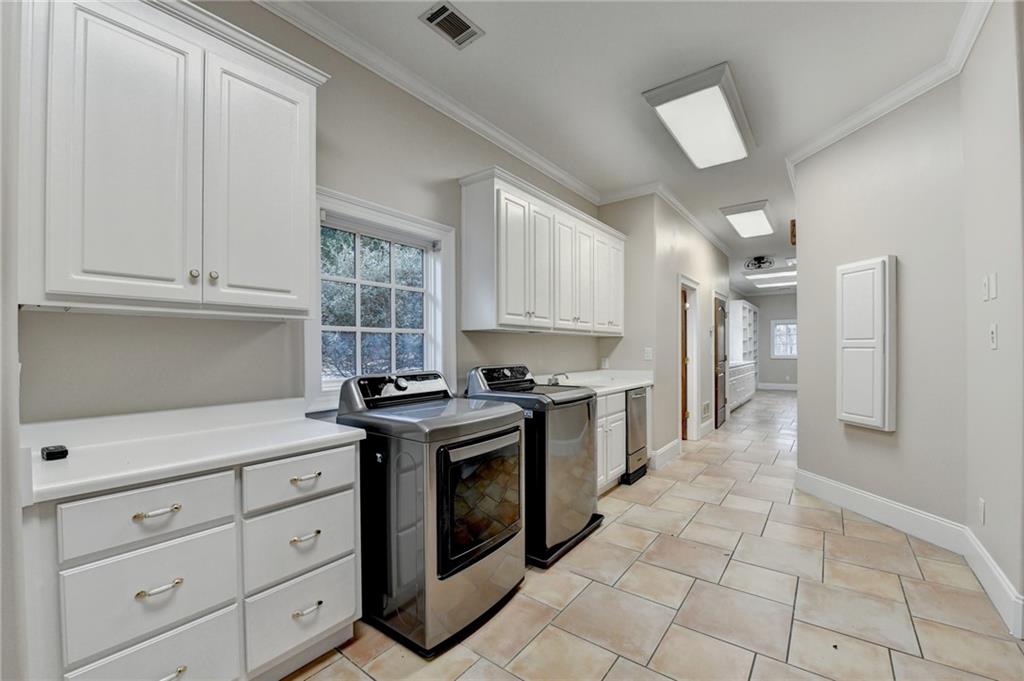 1540 Lipscomb Road Social Circle, GA 30025 - Photo 68 of 130 a kitchen with a stove a sink and a refrigerator