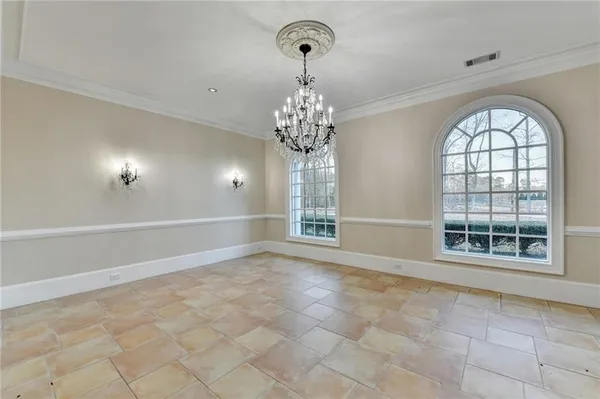 a kitchen with stainless steel appliances granite countertop a sink a stove and a wooden floors