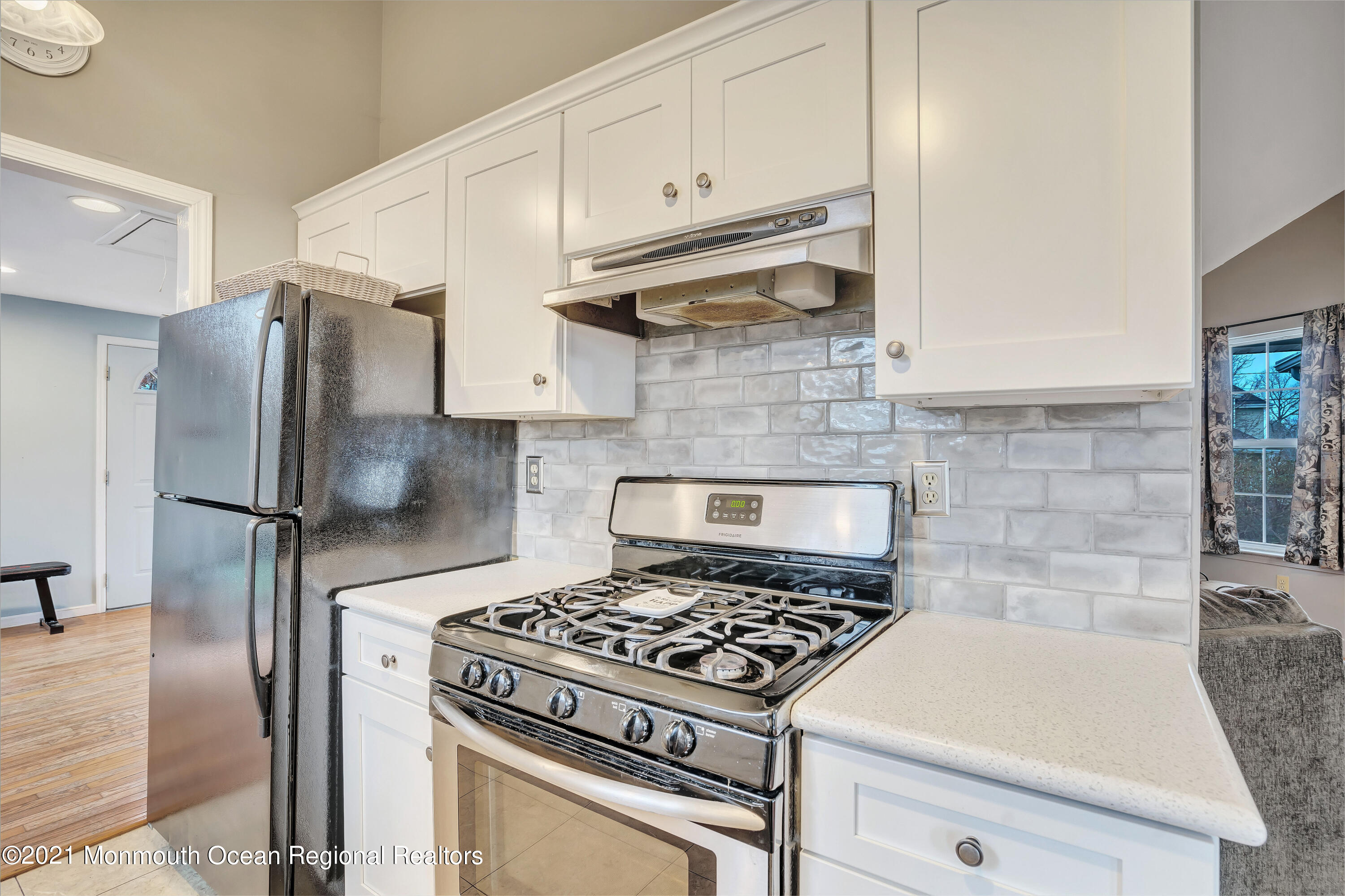 262 Privateer Road Manahawkin, NJ 08050 - Photo 11 of 20 a kitchen with stainless steel appliances granite countertop a stove a refrigerator and a cabinets