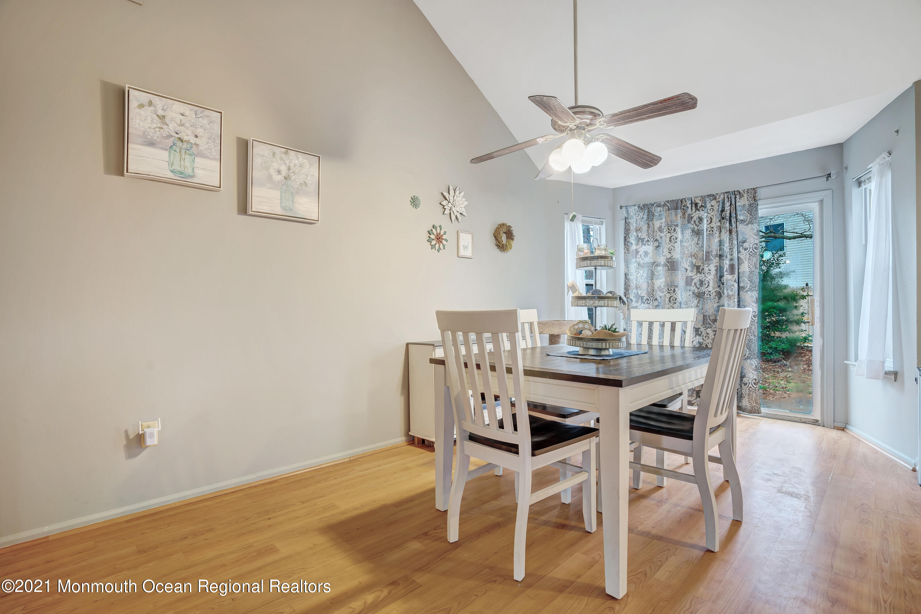 262 Privateer Road Manahawkin, NJ 08050 - Photo 5 of 20 a view of a dining room with furniture and wooden floor