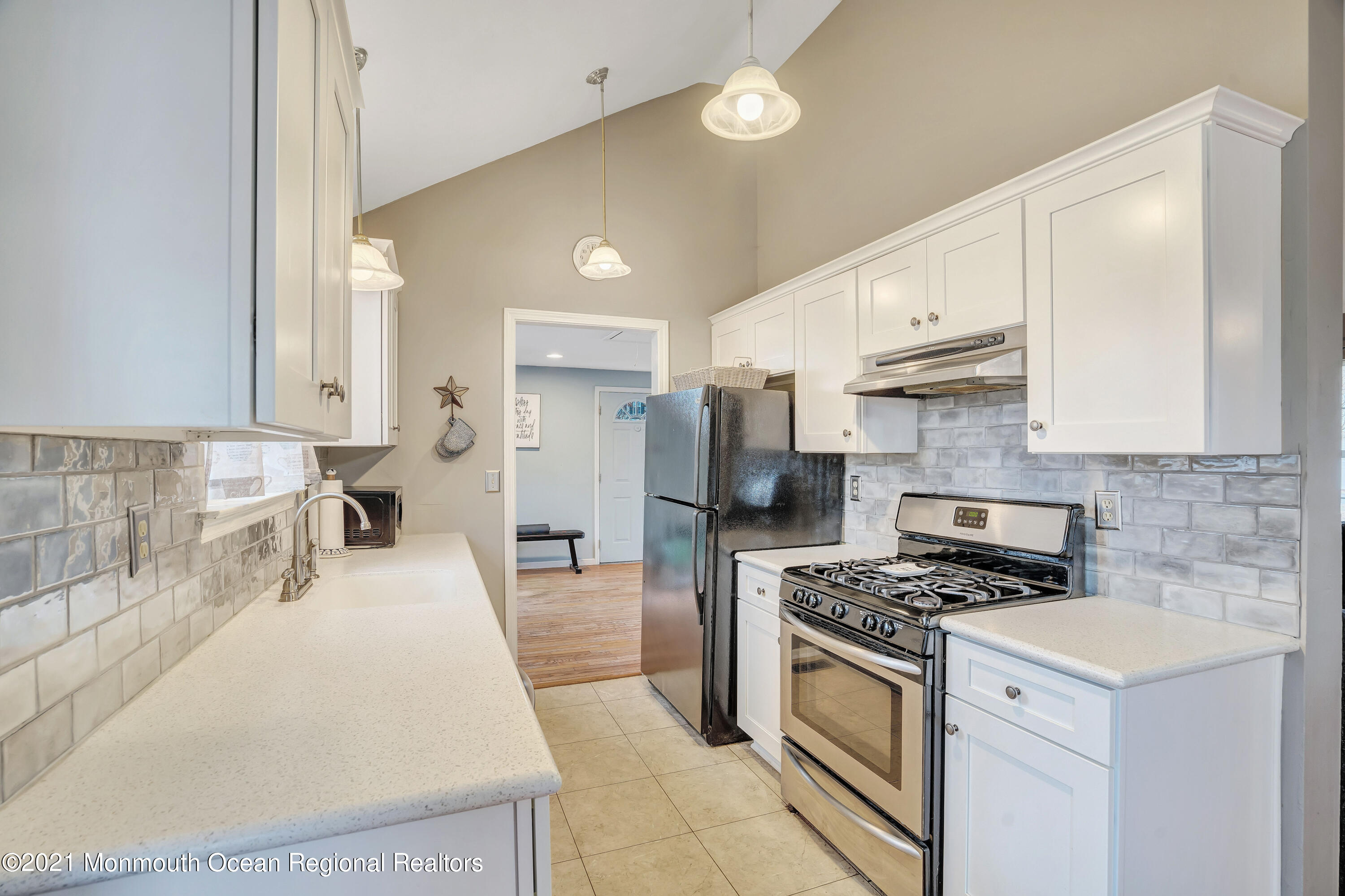 262 Privateer Road Manahawkin, NJ 08050 - Photo 7 of 20 a kitchen with granite countertop a sink a stove and refrigerator