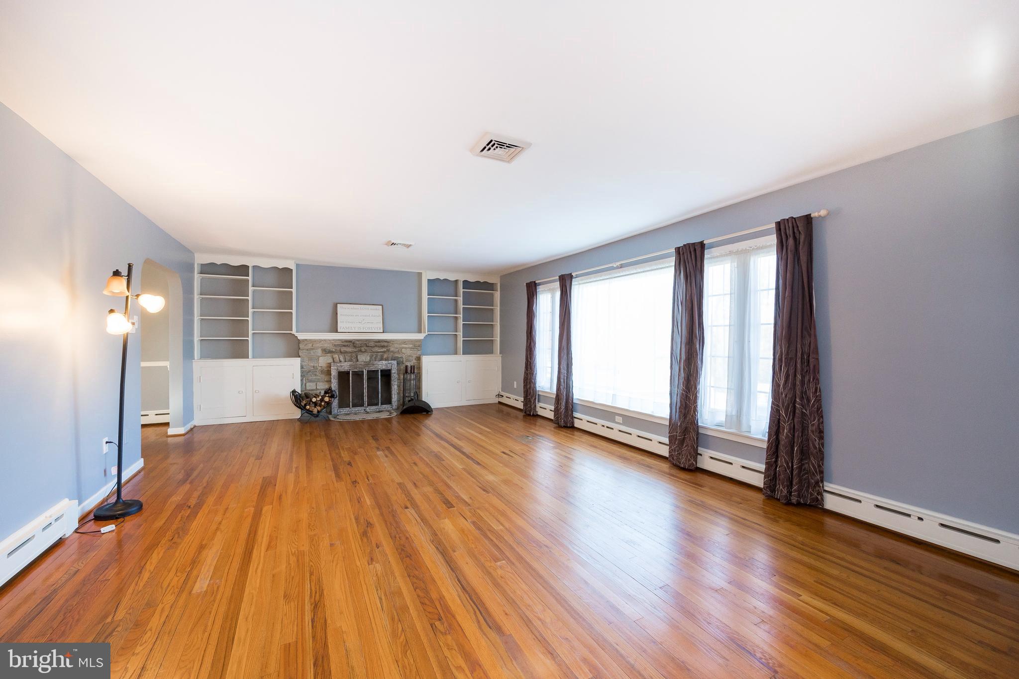 1504 Reed Street Coatesville, PA 19320 - Photo 4 of 33 Living Room with fireplace & built in cabinetry