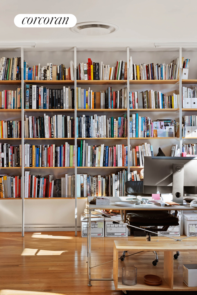 53 Elizabeth Street, Unit 4A Manhattan, NY 10013 - Photo 1 of 11 a view of a workspace with bookshelf