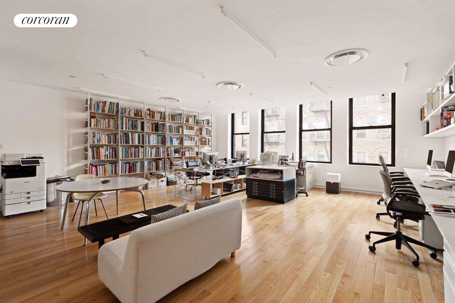 53 Elizabeth Street, Unit 4A Manhattan, NY 10013 - Photo 3 of 11 a living room with furniture floor to ceiling window and wooden floor