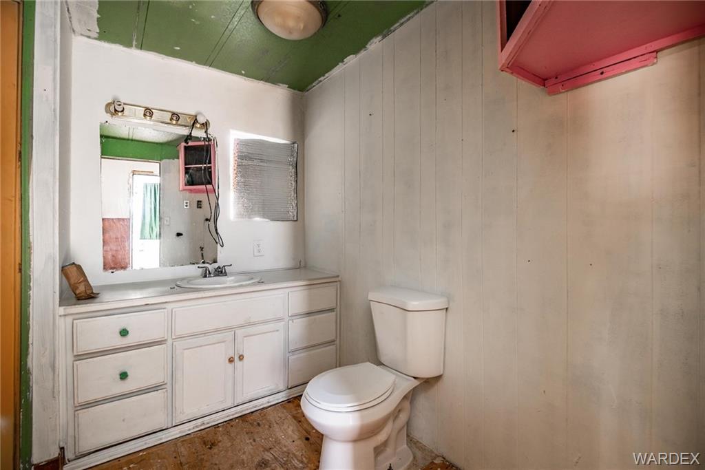1862 Rio Grande Road Bullhead City, AZ 86442 - Photo 9 of 24 a bathroom with a granite countertop toilet sink and mirror