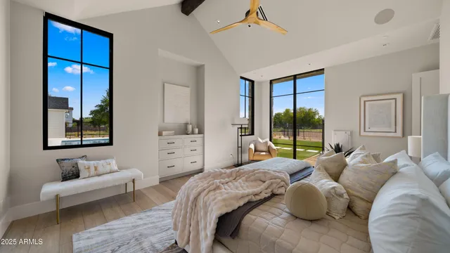 a dining room with furniture a chandelier and window