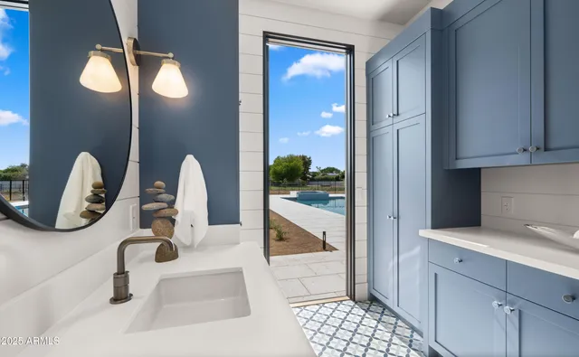 a view of a kitchen with washing machine and washing machine