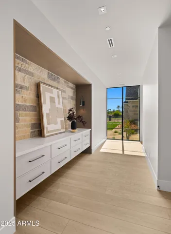 a view of a bathroom with a window sink and mirror