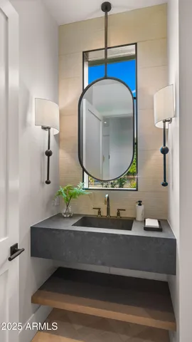 a bathroom with a sink and a mirror