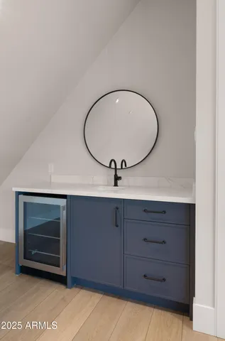 a living room with furniture a flat screen tv and a floor to ceiling window