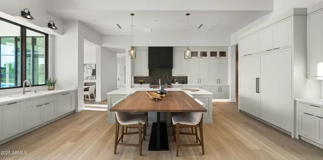 a open kitchen with stainless steel appliances granite countertop a lot of counter space and wooden floor