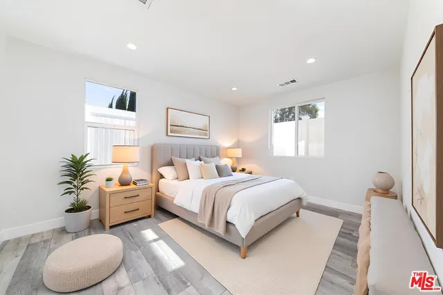 a bed room with a bed and a couch