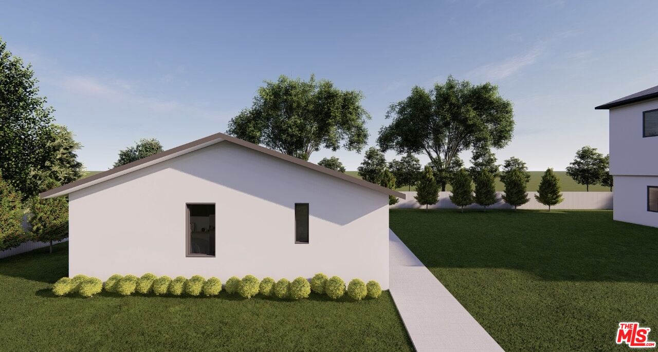 8446 Penfield Avenue Winnetka, CA 91306 - Photo 40 of 46 a white house with green field in front of it