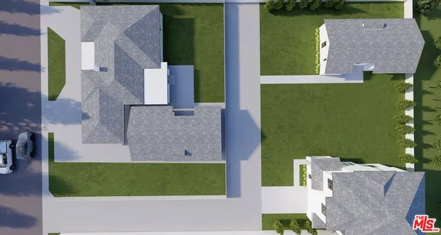 an aerial view of a house with a garden and a yard