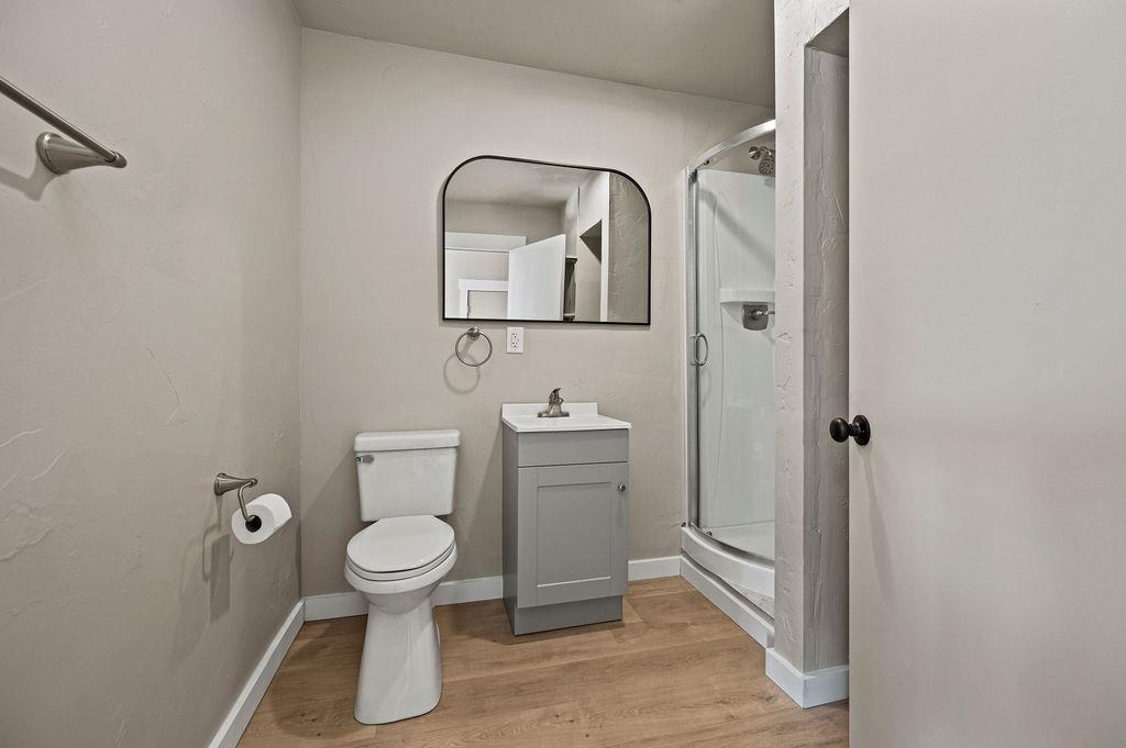 508 Rosa Street Palisade, CO 81526 - Photo 13 of 18 a white toilet sitting next to a bathroom sink