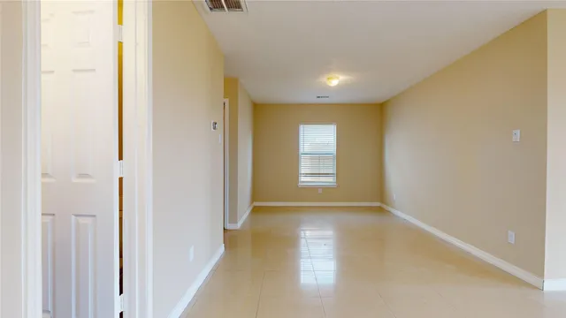 a view of hallway with windows