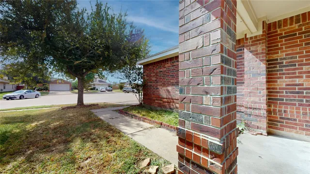 a view of a street with a building in the background
