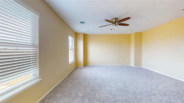 a view of a livingroom with a ceiling fan