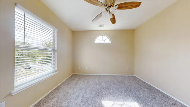 a view of empty room with a window