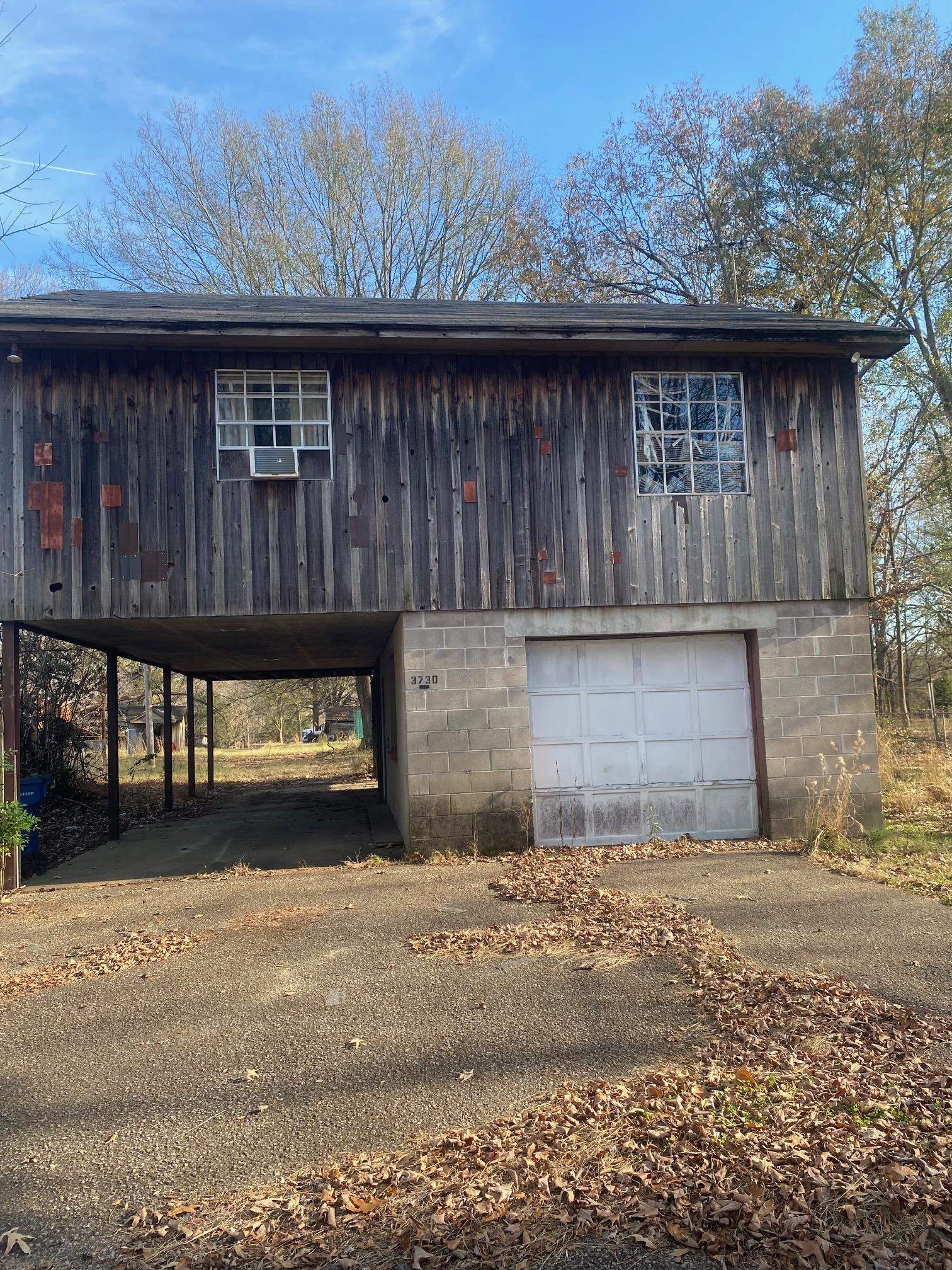 3734 Old Brownsville Road Memphis, TN 38135 - Photo 4 of 8 a front view of a house with a garden