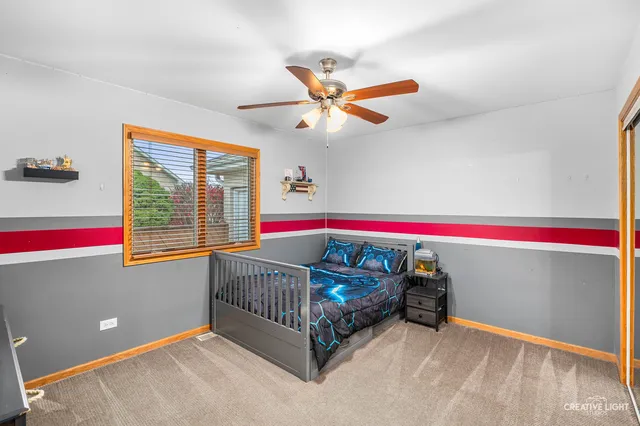 a room with window and a ceiling fan