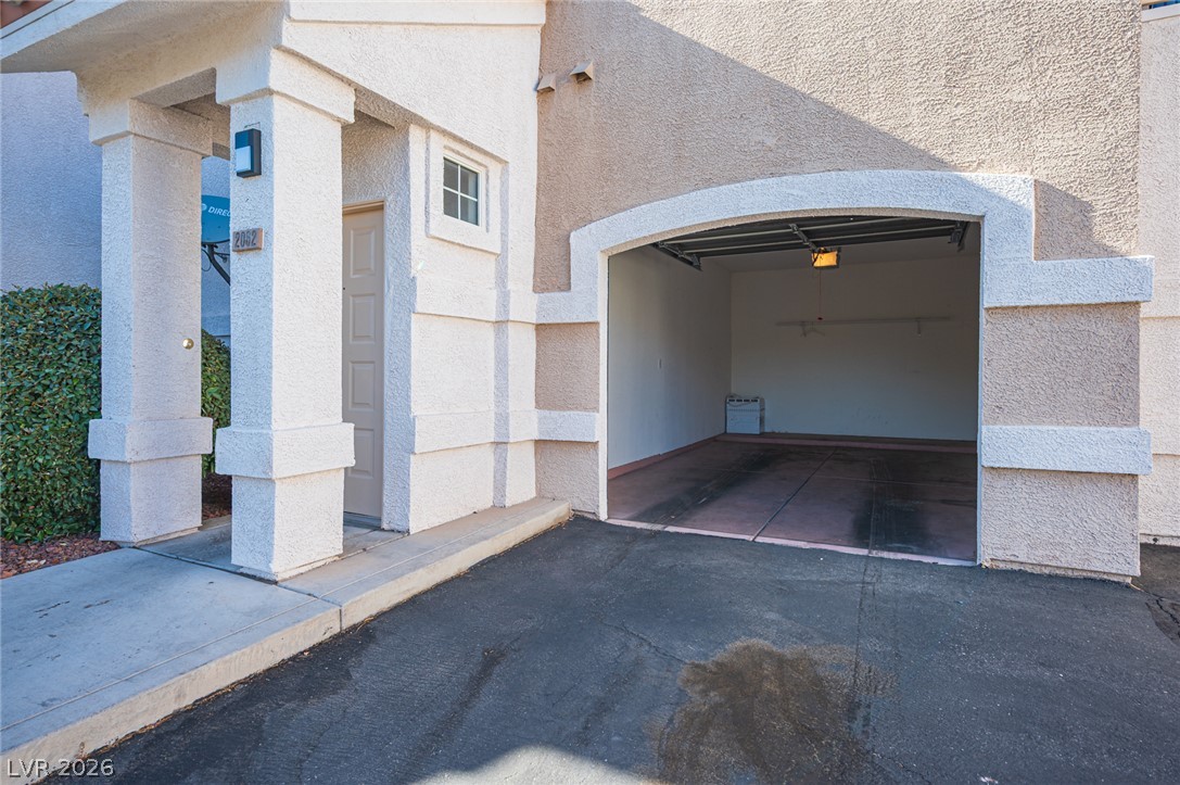 8555 West Russell Road, Unit 2062 Las Vegas, NV 89113 - Photo 3 of 35 Secure parking solutions are offered by this attached garage, providing direct access to the home's entry.