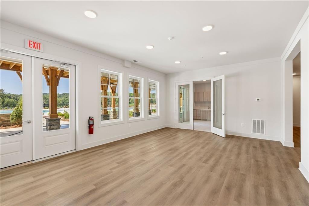 2682 Harbor Rdg Pass Gainesville, GA 30507 - Photo 19 of 42 a view of an empty room with glass door and balcony