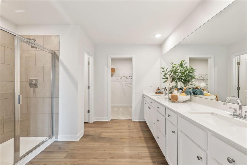 2682 Harbor Rdg Pass Gainesville, GA 30507 - Photo 24 of 42 a bathroom with a double vanity sink and a mirror