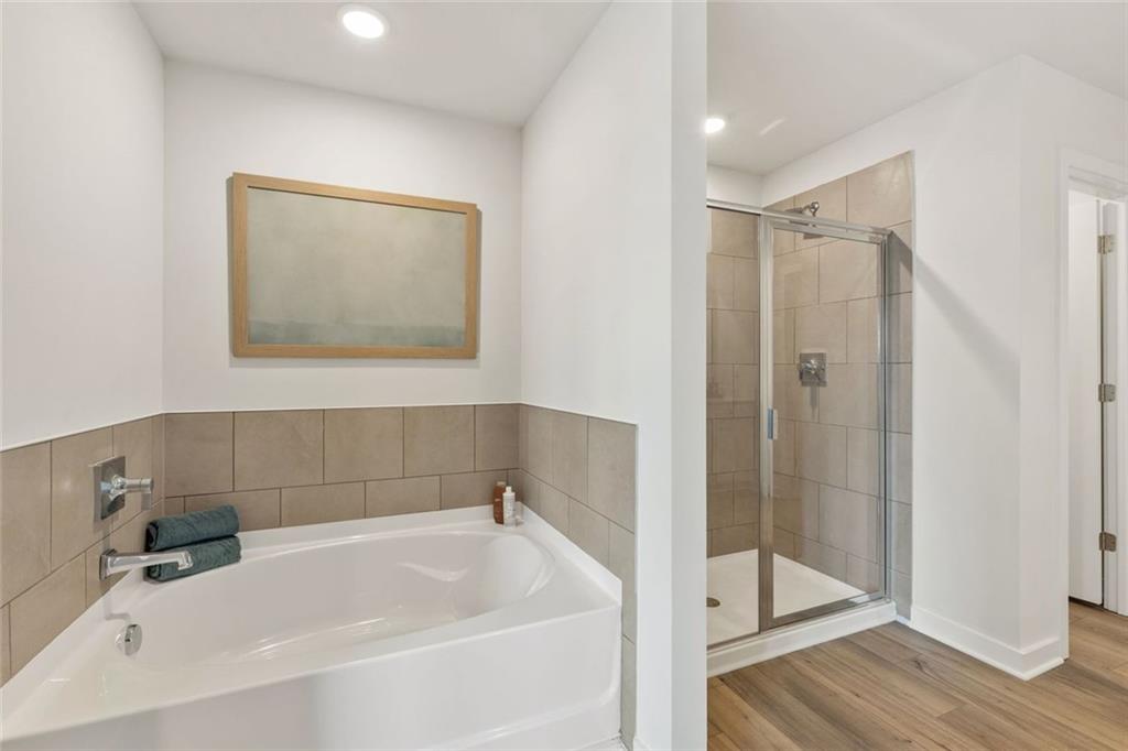 2682 Harbor Rdg Pass Gainesville, GA 30507 - Photo 25 of 42 a white bath tub sitting next to a white sink