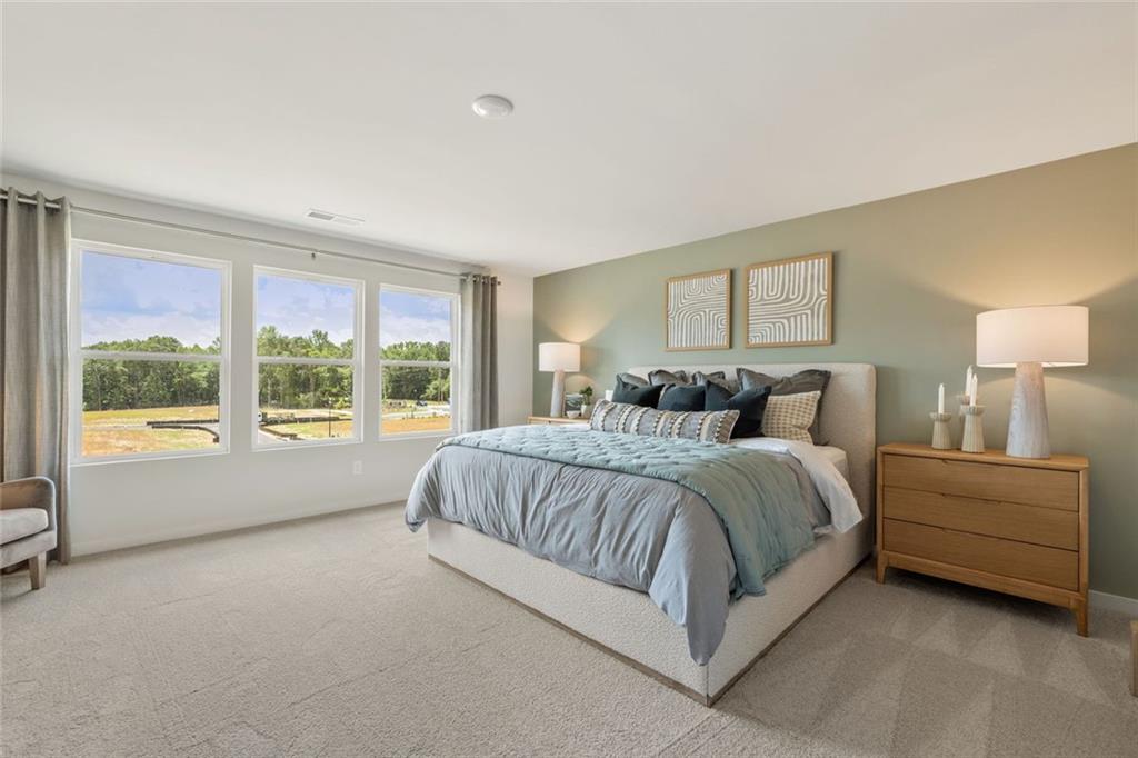 2682 Harbor Rdg Pass Gainesville, GA 30507 - Photo 26 of 42 a spacious bedroom with a bed and a large window