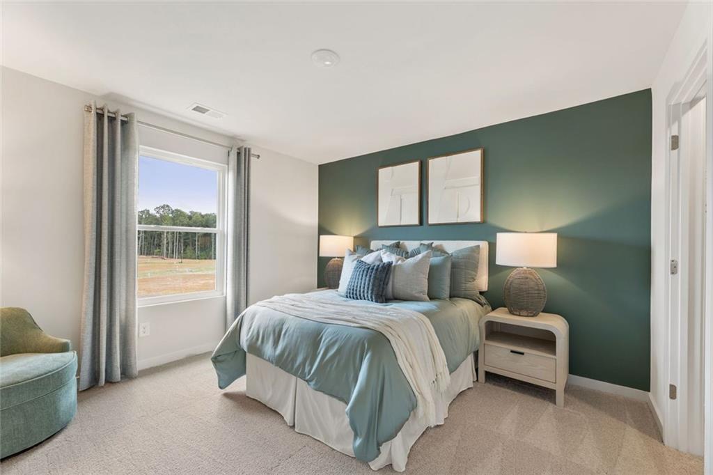 2682 Harbor Rdg Pass Gainesville, GA 30507 - Photo 28 of 42 a bedroom with a bed and a couch