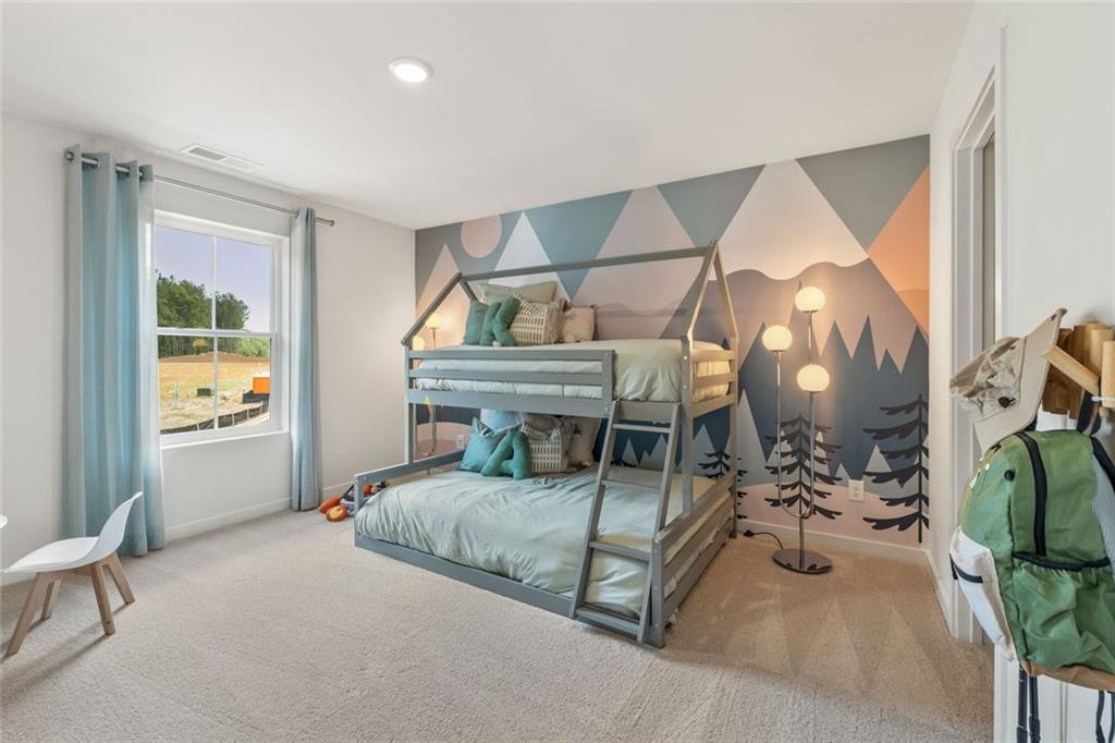 2682 Harbor Rdg Pass Gainesville, GA 30507 - Photo 29 of 42 a bedroom with furniture and a window