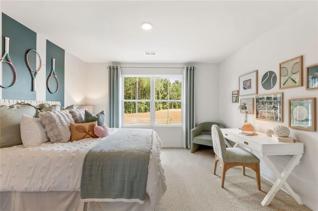 2682 Harbor Rdg Pass Gainesville, GA 30507 - Photo 32 of 42 a bedroom with a bed and a table