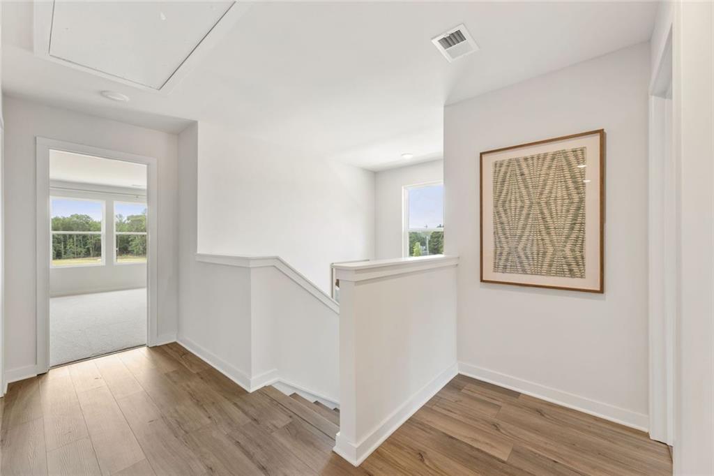 2682 Harbor Rdg Pass Gainesville, GA 30507 - Photo 34 of 42 a view of an empty room with wooden floor and a window