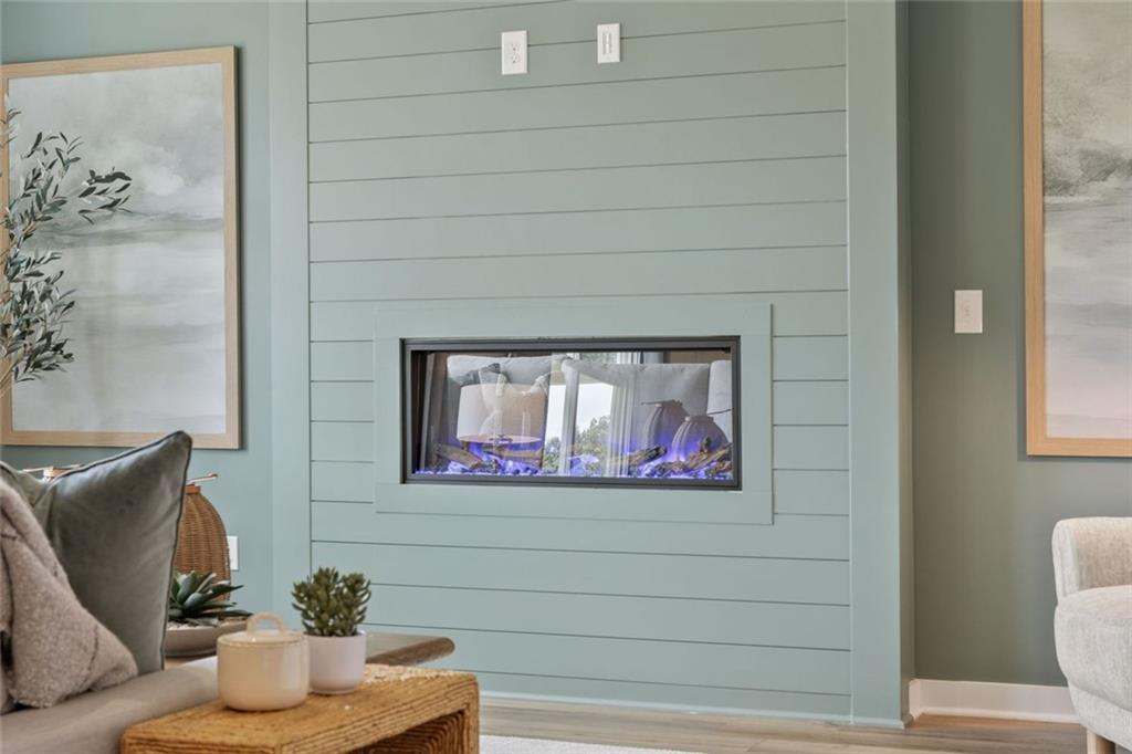 2682 Harbor Rdg Pass Gainesville, GA 30507 - Photo 36 of 42 a living room with furniture and a painting on the wall