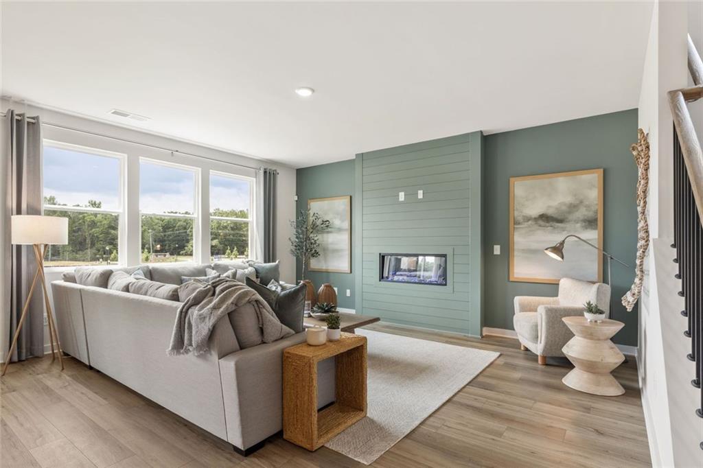 2682 Harbor Rdg Pass Gainesville, GA 30507 - Photo 37 of 42 a living room with furniture and a large window