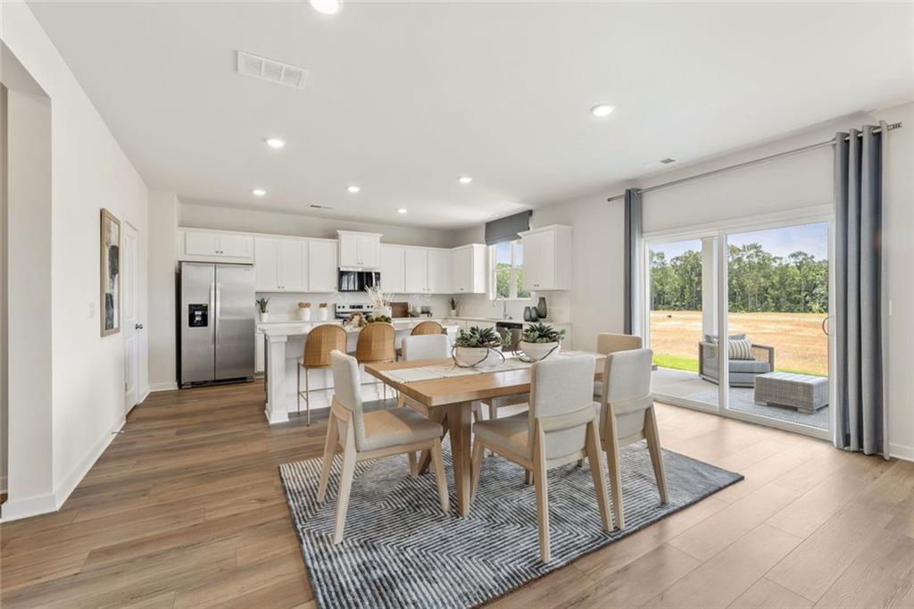 2682 Harbor Rdg Pass Gainesville, GA 30507 - Photo 40 of 42 a view of a dining room with furniture window and outside view
