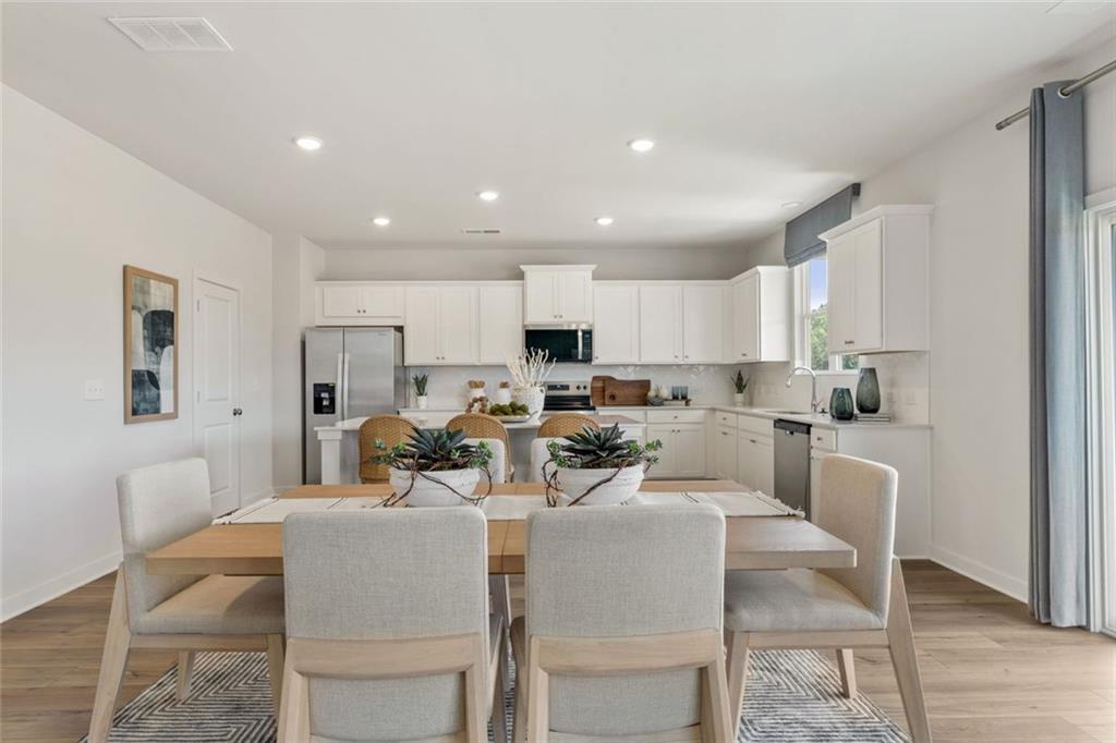 2682 Harbor Rdg Pass Gainesville, GA 30507 - Photo 42 of 42 a view of a dining room with furniture