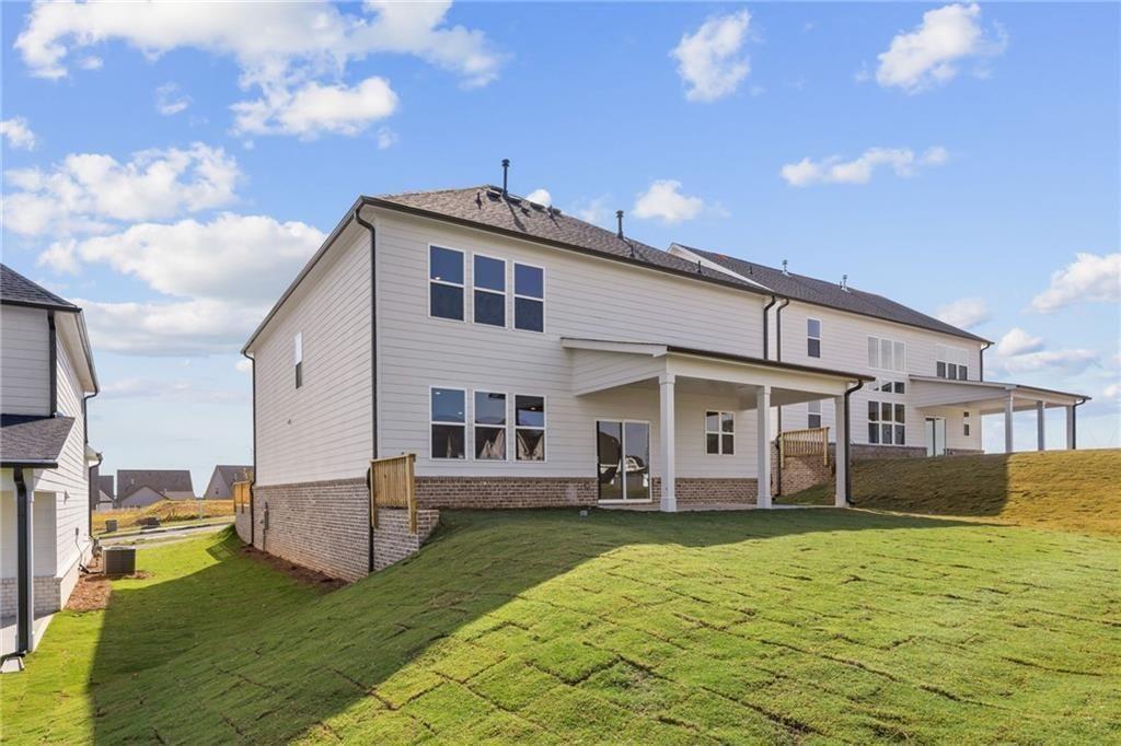 2682 Harbor Rdg Pass Gainesville, GA 30507 - Photo 8 of 42 a front view of a house with a yard