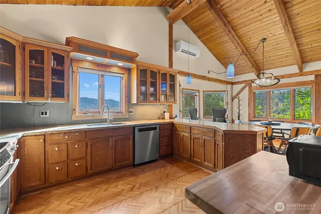 a large kitchen with a large window and counter space