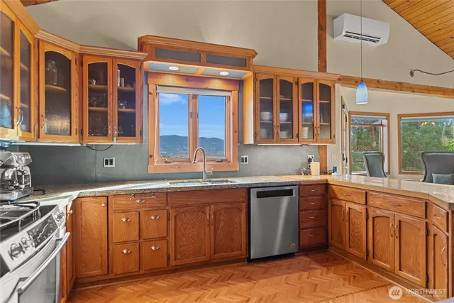 a kitchen with a sink stove and cabinets